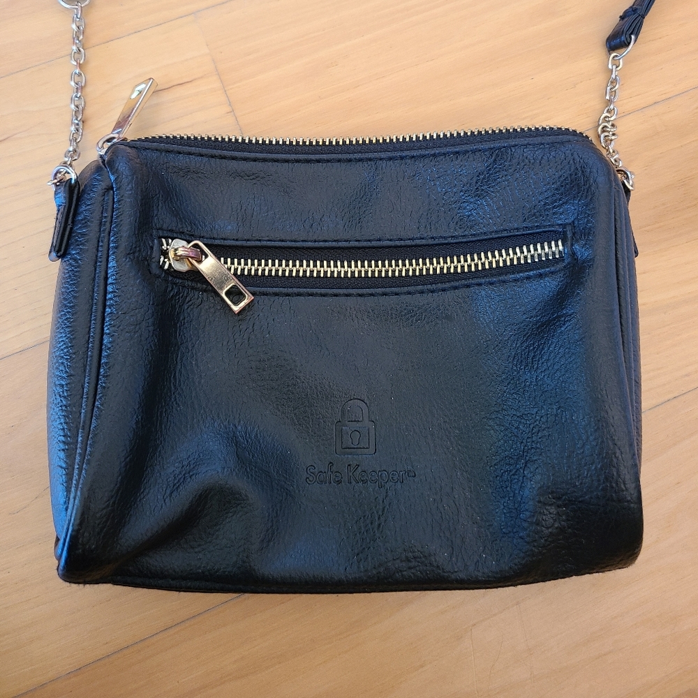 Safe Keeper cross-body black and gold small travel bag purse